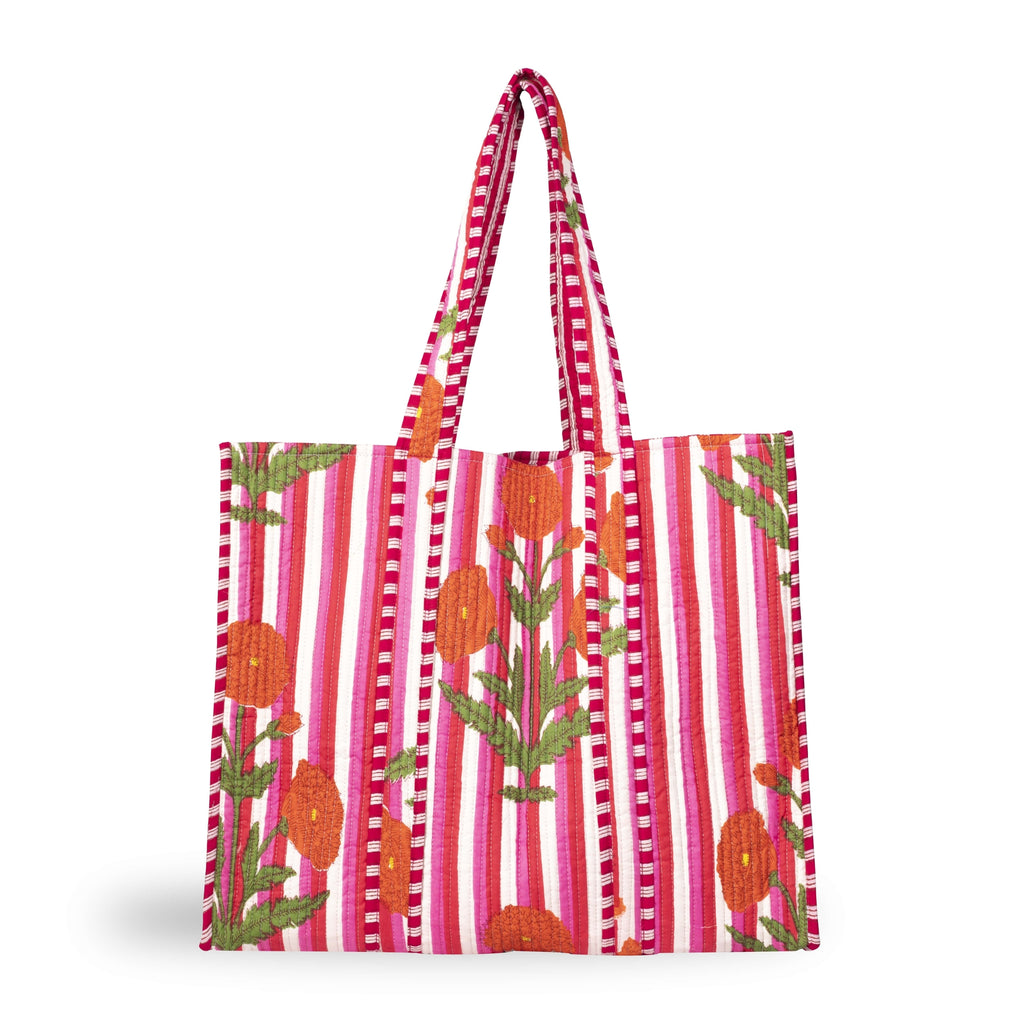 A bold and colourful cotton tote bag with a stripe and floral design in strong pinks, oranges, reds and greens