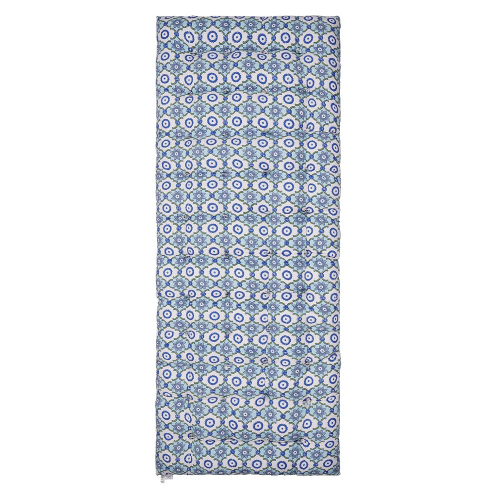 Patterned block printed mattress with blue and white geometric design on a white background