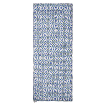 Patterned block printed mattress with blue and white geometric design on a white background