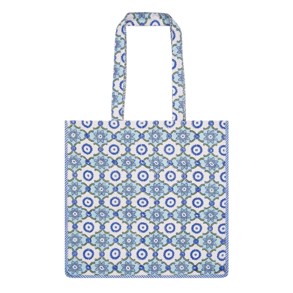 A block-printed cotton tote bag with a geometric pattern and contrast trim in blues and greens