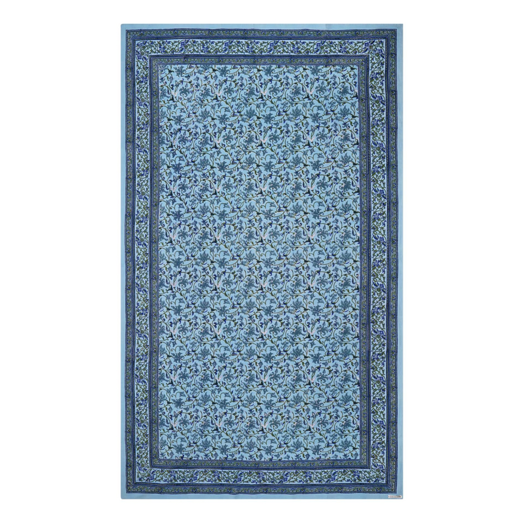 A rectangular tablecloth with a sky blue base and an intricate floral jaal pattern, displayed on a white background.