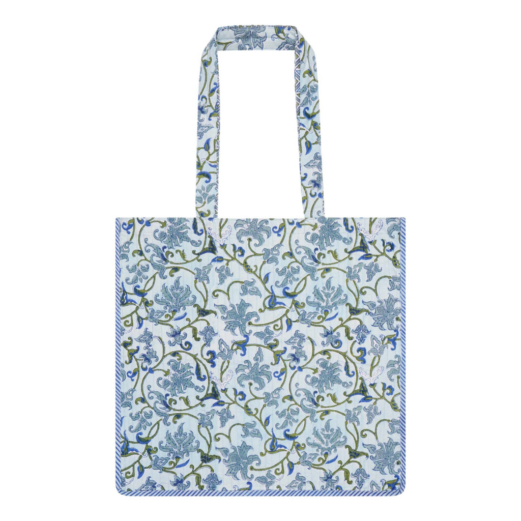 A block printed cotton tote bag with contrast trim and a botanical design