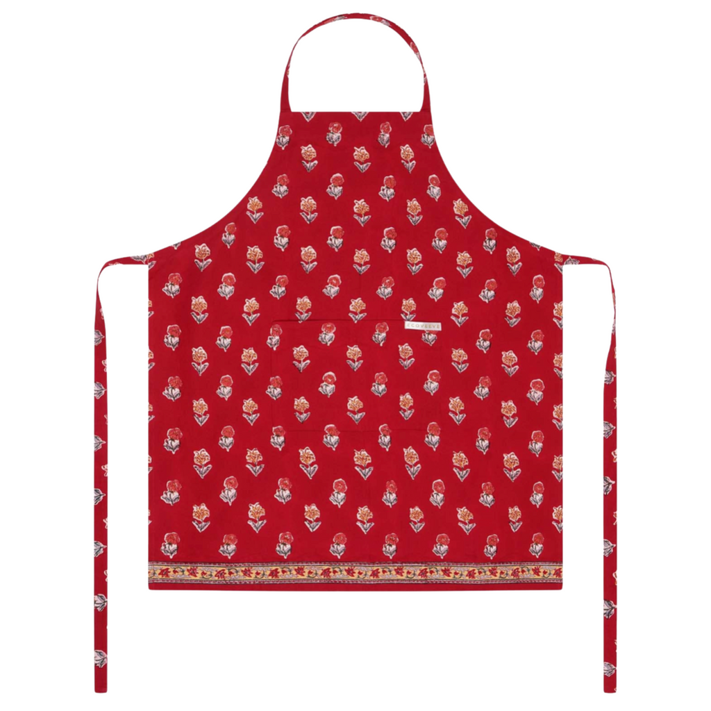 Red block printed apron with a floral pattern on a white background