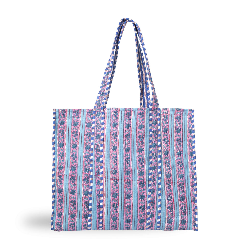A stylish printed cotton tote bag with a striped botanical design in pinks, blues and purples