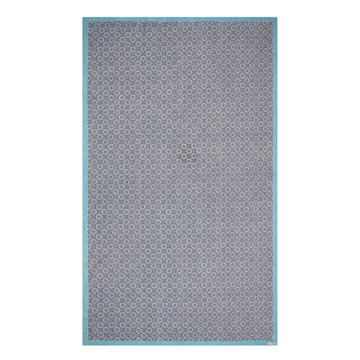 A rectangular tablecloth with a geometric pattern in shades of blue and green, with a solid white border.