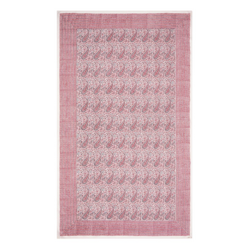 Pink block printed tablecloth with paisley pattern on a white background