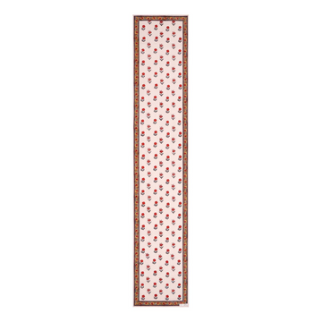 Block printed floral design table runner with border in reds, whites and yellows
