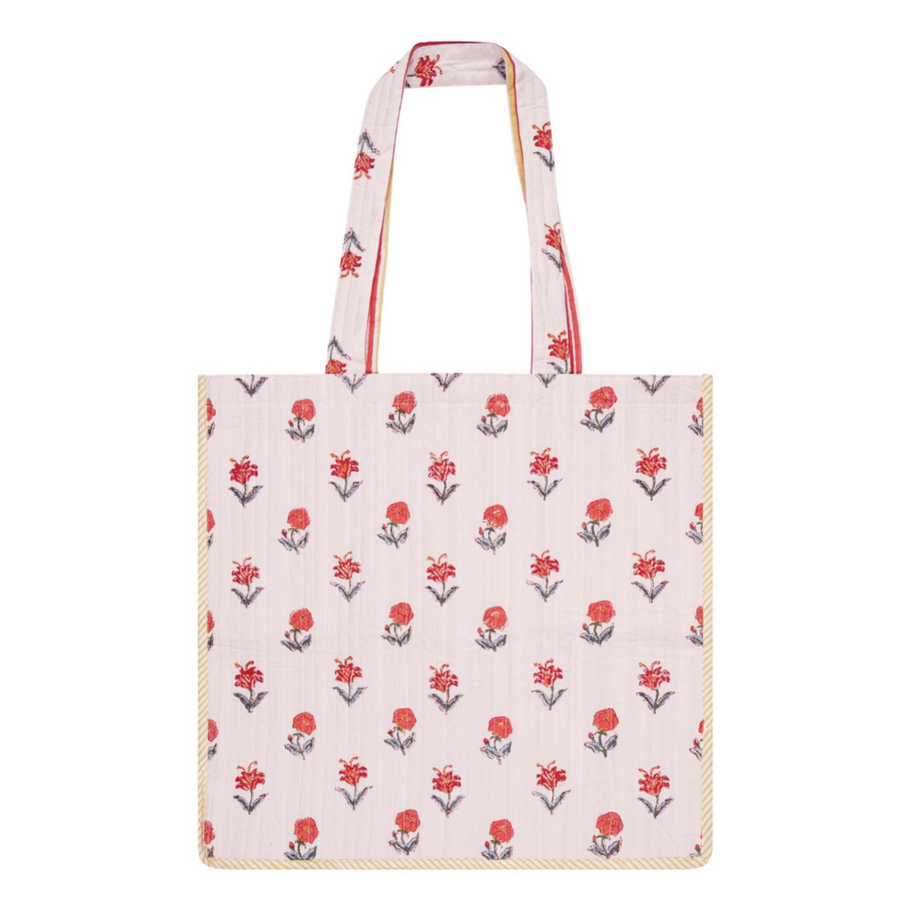 A block printed cotton tote bag with contrast trim with a floral design
