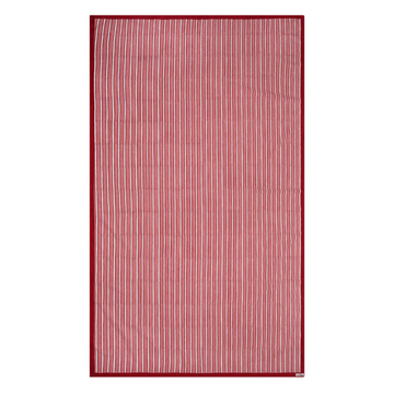 Red and white striped block printed tablecloth on a white background