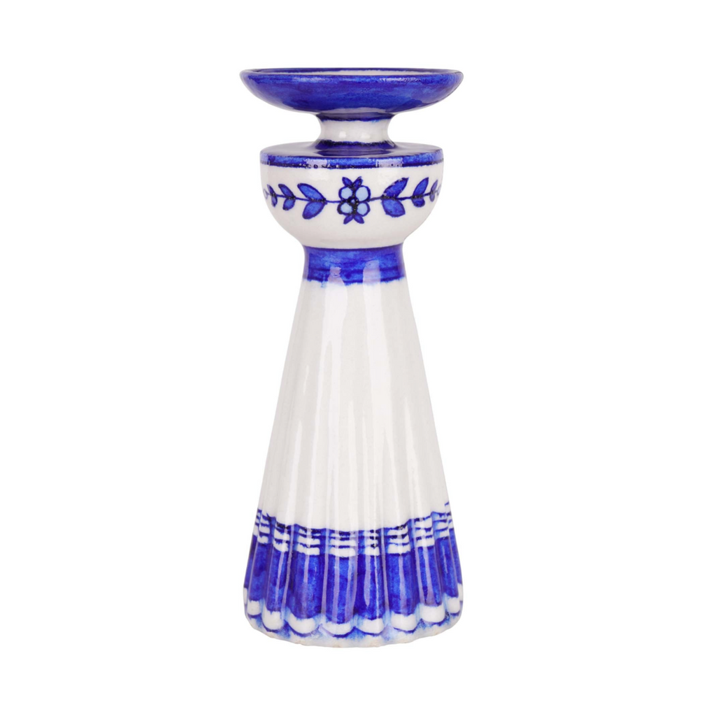 Ceramic candle holder with blue and white design on a white background