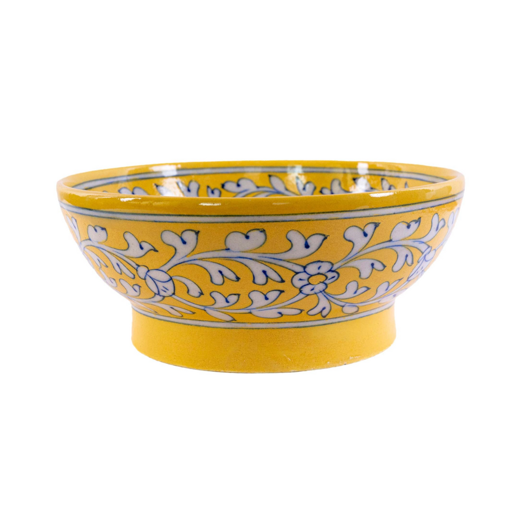 A yellow Jaipur pottery fruit bowl with a floral design
