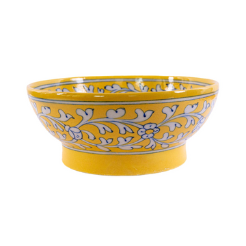 A yellow Jaipur pottery fruit bowl with a floral design